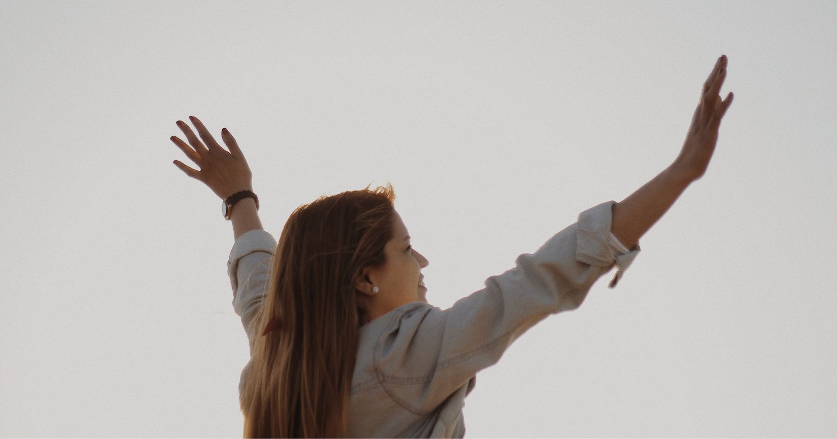 woman with raised arms